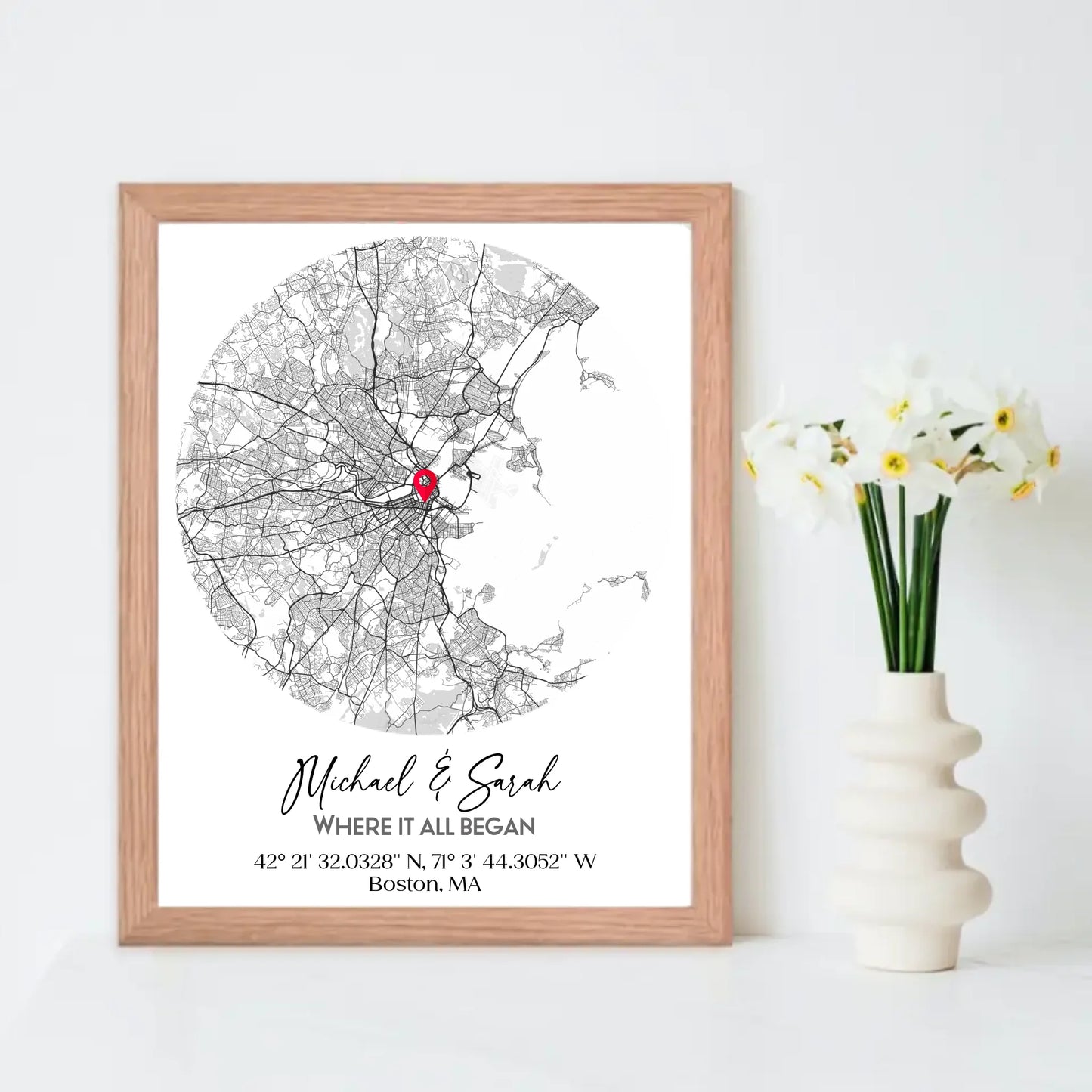 Where We Met Map Gift with an 11x14 inch red oak frame, showing a city map with a red pin marking a location, personalized with the names 'Michael & Sarah' and coordinates for Boston, MA.