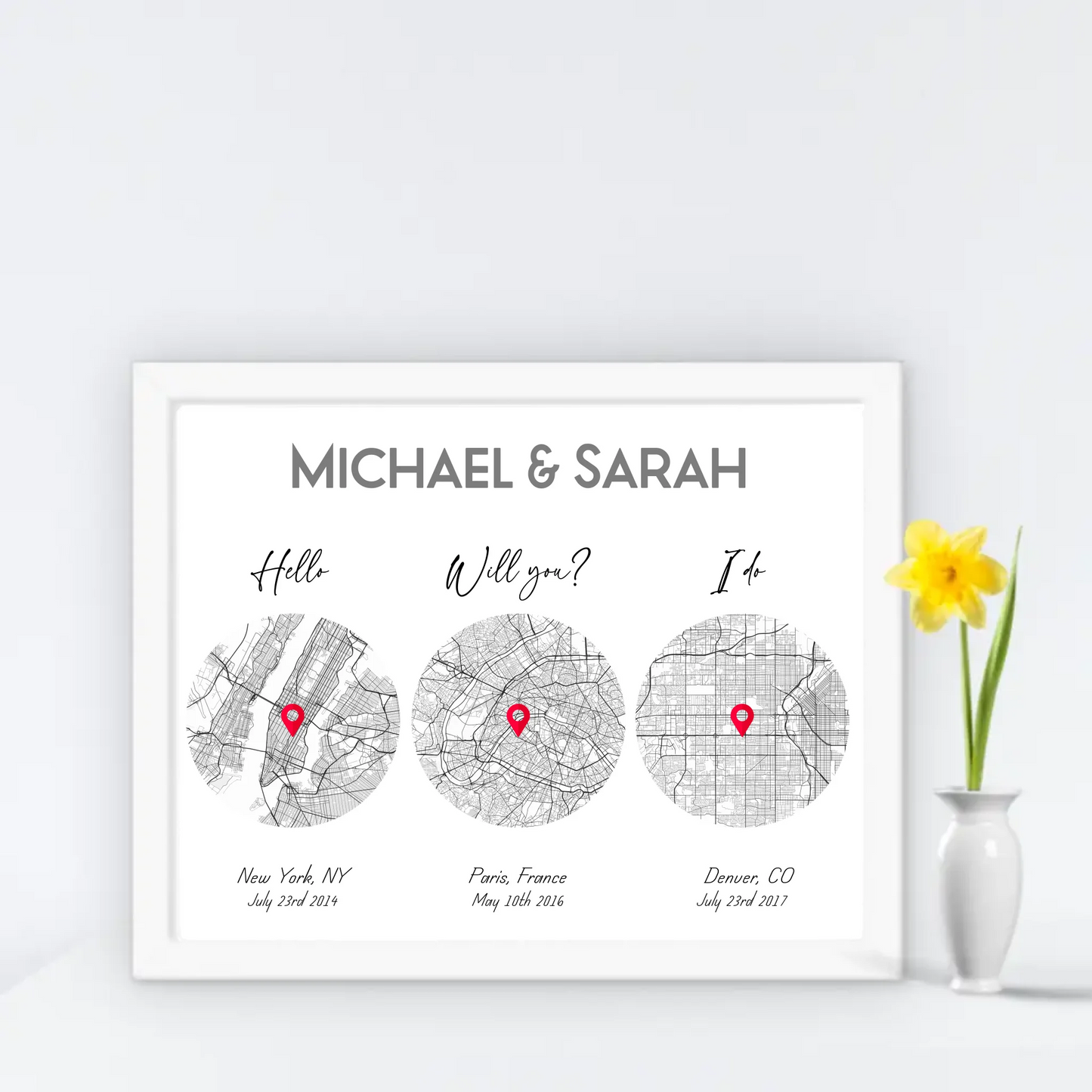 14x11 inch print with a white frame, showing a city map with three different locations of Hello Will you I do, personalized with the names 'Michael & Sarah’, places, and coordinates.