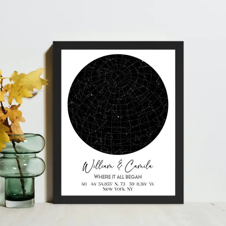 Black framed 11x14 inch custom star map featuring a black circular night sky with constellations, personalized with the names 'William & Camila,' coordinates, and the message 'Where It All Began'