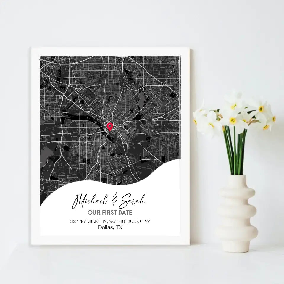 11x14 inch framed Our First Date map print with a white frame, showing a city map with a red pin marking a location, personalized with the names 'Michael & Sarah' and coordinates for Dallas, TX.