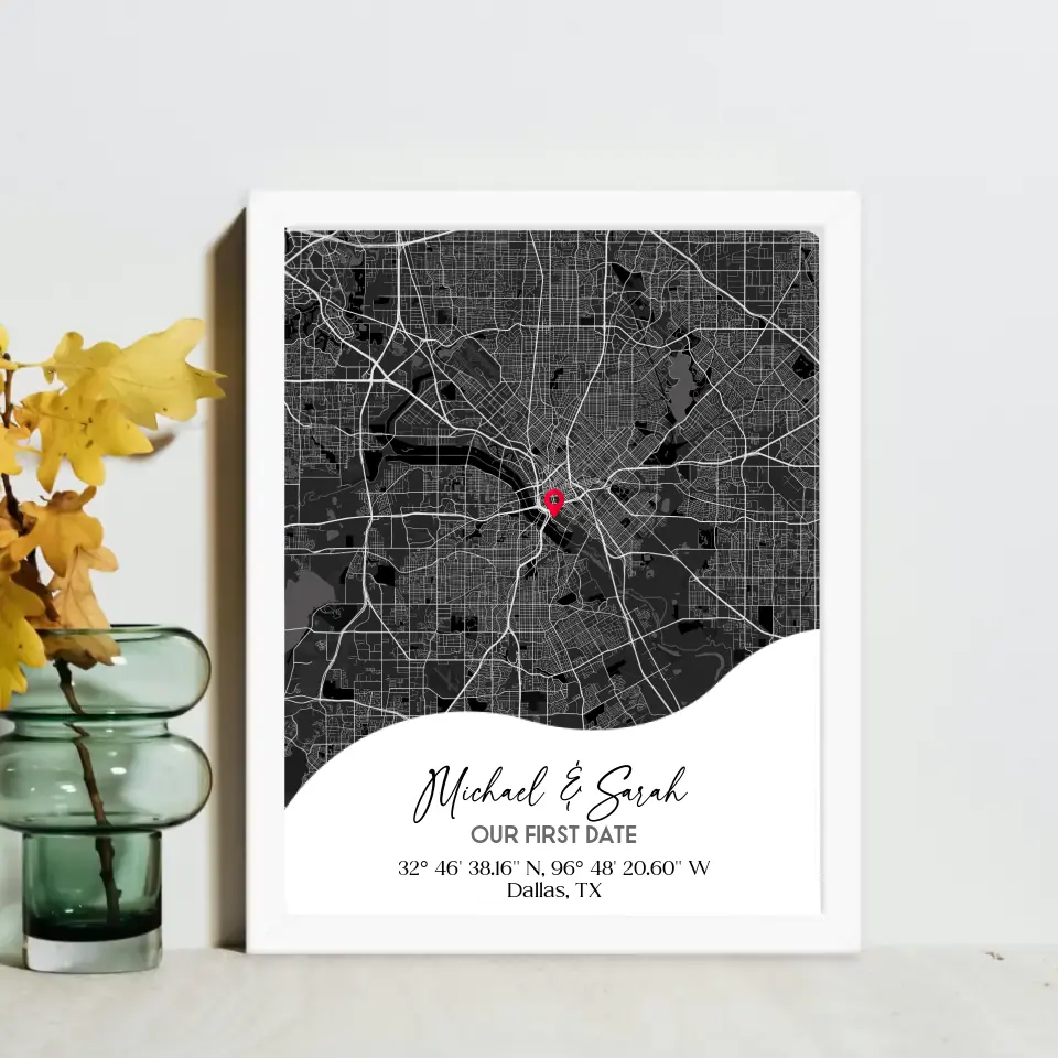 16x20 inch framed Our First Date map print with a white frame, showing a city map with a red pin marking a location, personalized with the names 'Michael & Sarah' and coordinates for Dallas, TX.