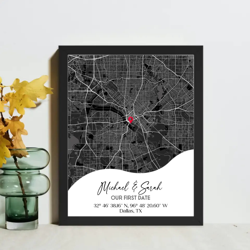 16x20 inch framed Our First Date map print with a black frame, showing a city map with a red pin marking a location, personalized with the names 'Michael & Sarah' and coordinates for Dallas, TX.