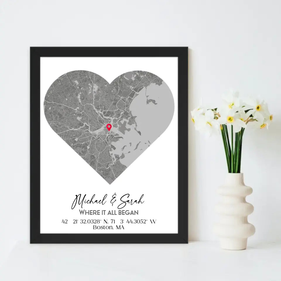 Where We Met Map Gift with a 16x20 inch black frame, showing a city map with a red pin marking a location, personalized with the names 'Michael & Sarah' and coordinates for Boston, MA.