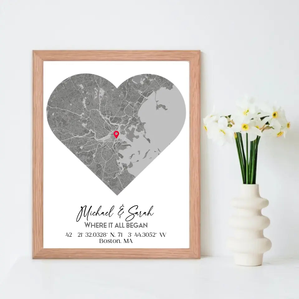 Where We Met Map Gift with a 16x20 inch red oak frame, showing a city map with a red pin marking a location, personalized with the names 'Michael & Sarah' and coordinates for Boston, MA.