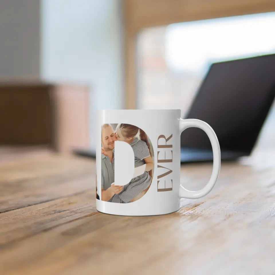 The right side of 11oz mug for the best dad ever features a photo collage inside the word 'DAD,' with the text 'The best dad ever’ placed on the table.