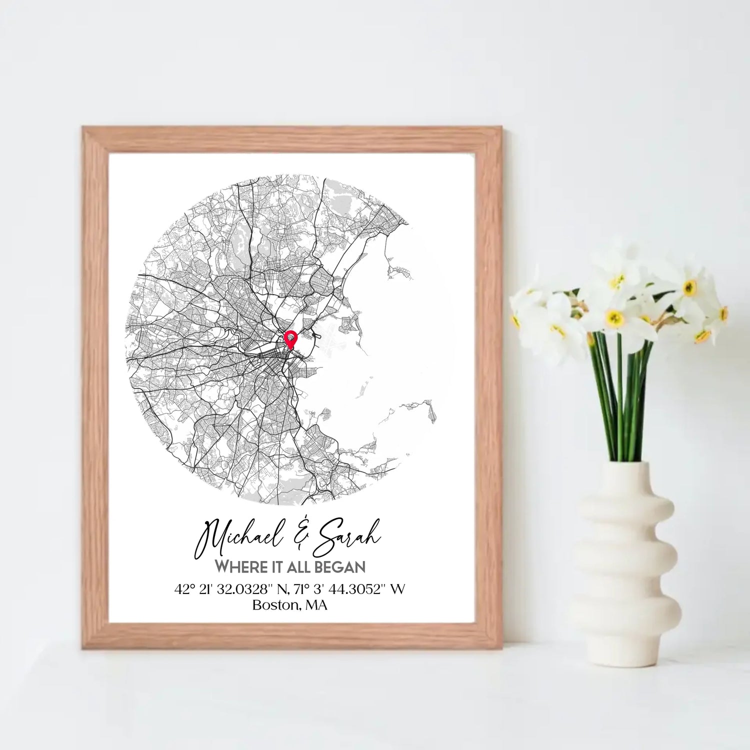 Where We Met Map Gift with a 16x20 inch red oak frame, showing a city map with a red pin marking a location, personalized with the names 'Michael & Sarah' and coordinates for Boston, MA.