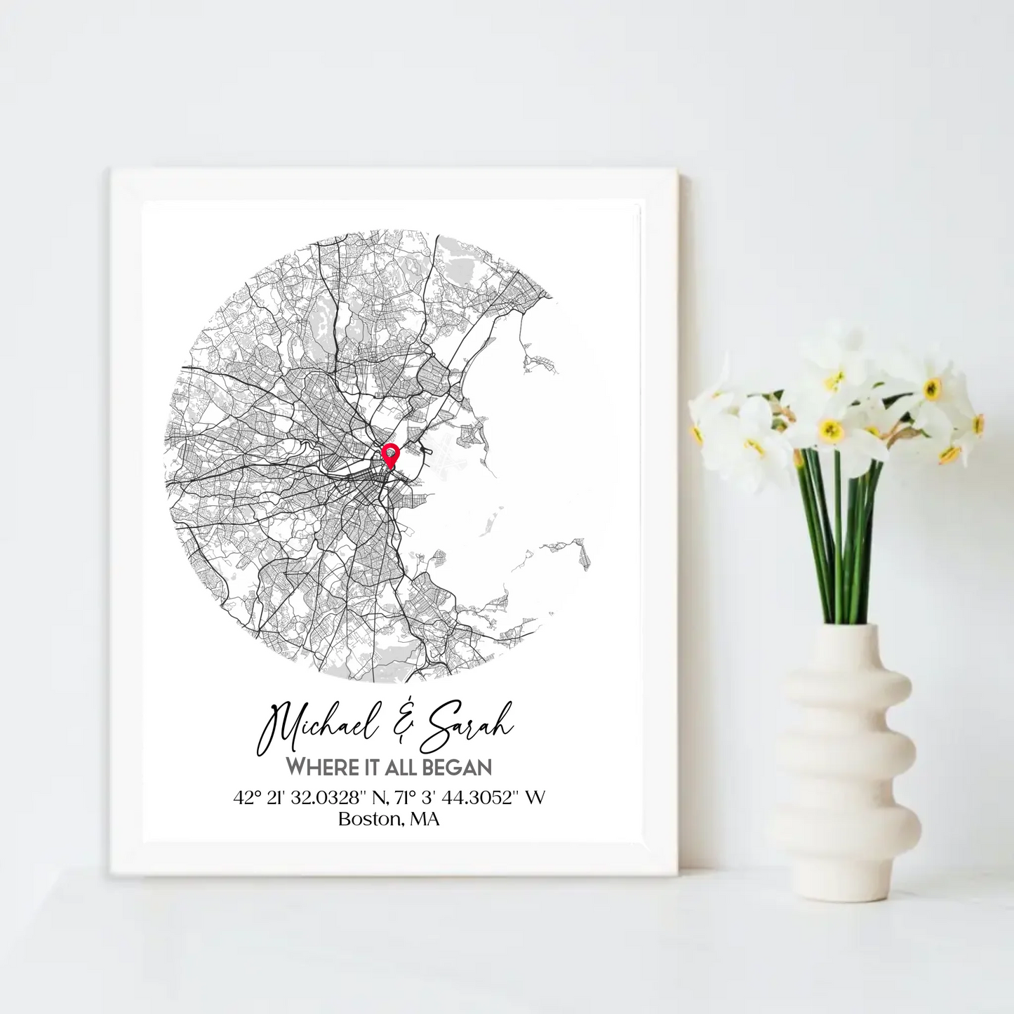 Where We Met Map Gift with a 16x20 inch white frame, showing a city map with a red pin marking a location, personalized with the names 'Michael & Sarah' and coordinates for Boston, MA.