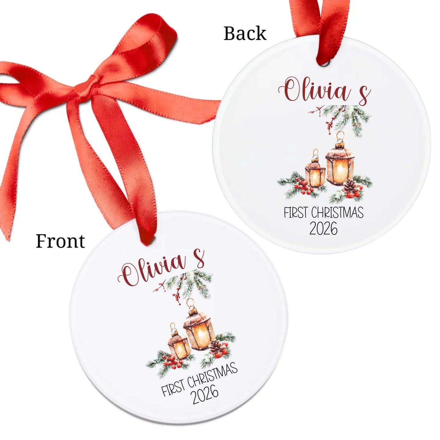 Two Christmas ornaments with a red ribbon, one showing the front and one the back, featuring the text 'Olivia's First Christmas 2026'.